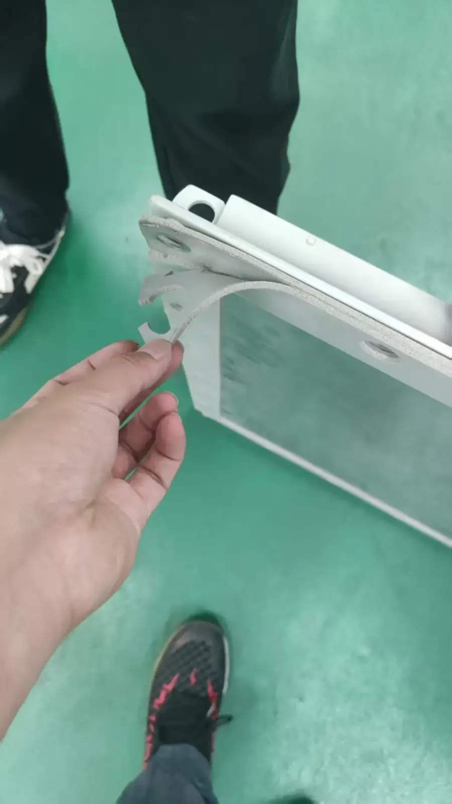 On-site inspection of energy storage unit bracket and assembly components at Chinese factory